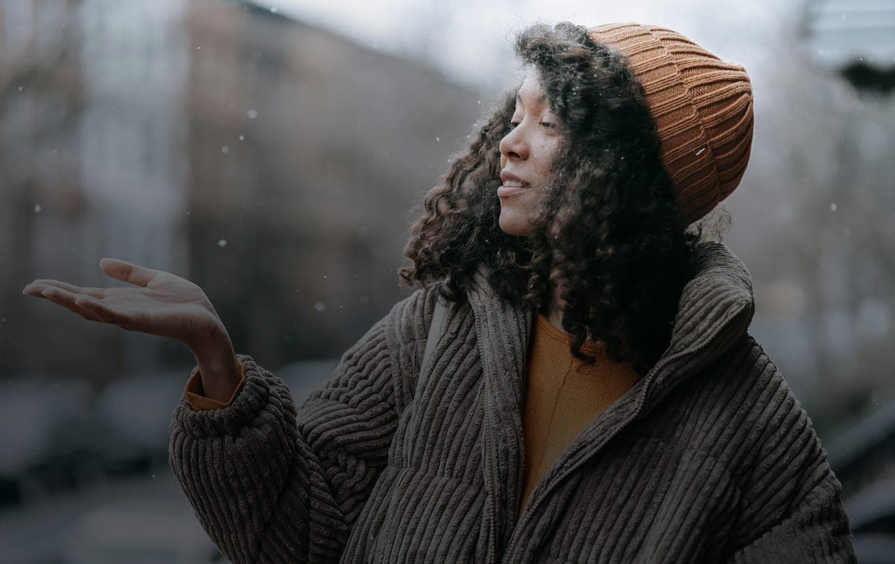A woman outdoors after completing verification